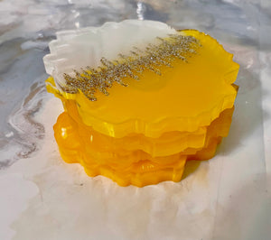 White and yellow resin coasters